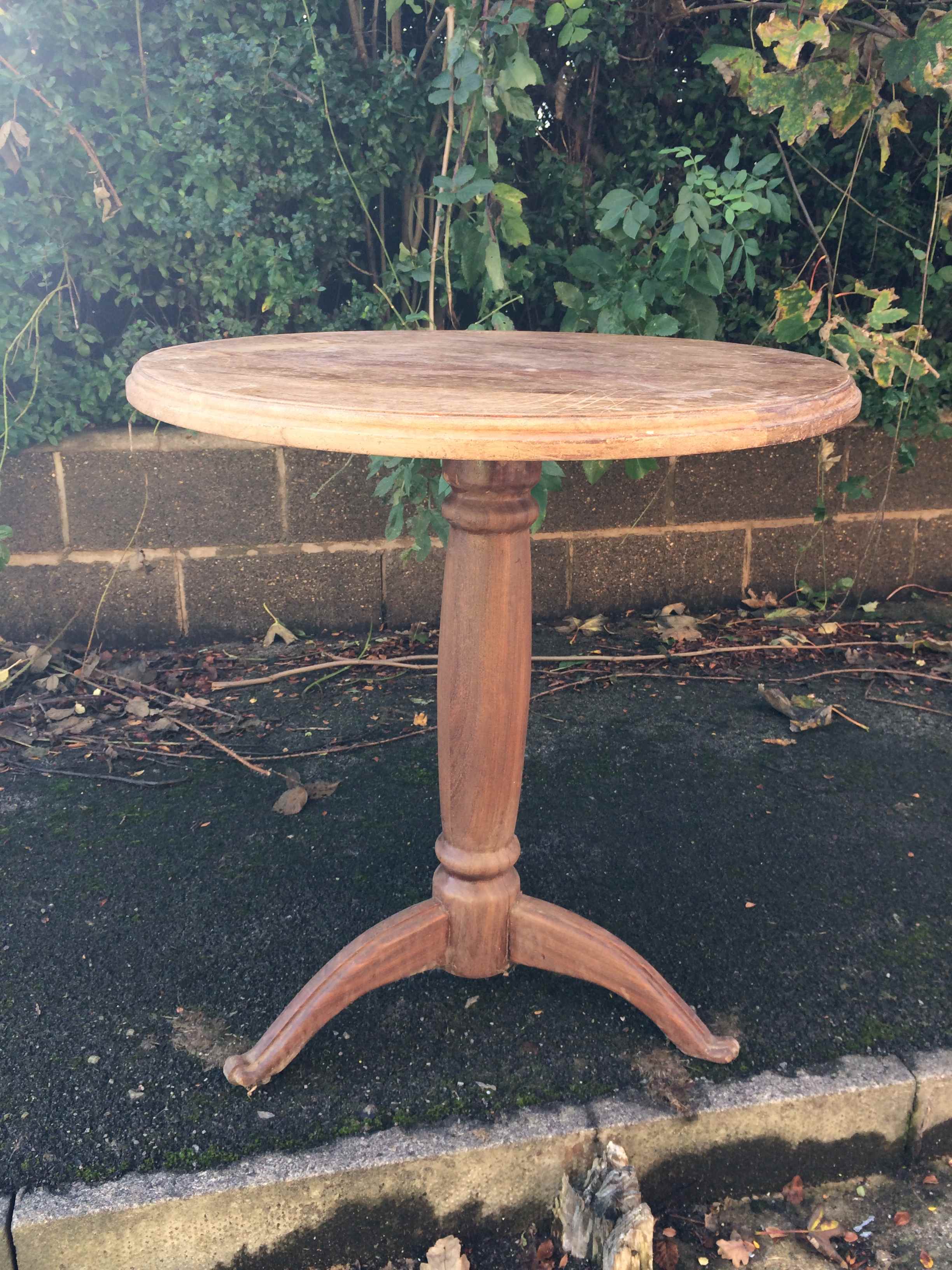 Rustic large tripod feet table with decorative turned column. Naturally stripped with age.