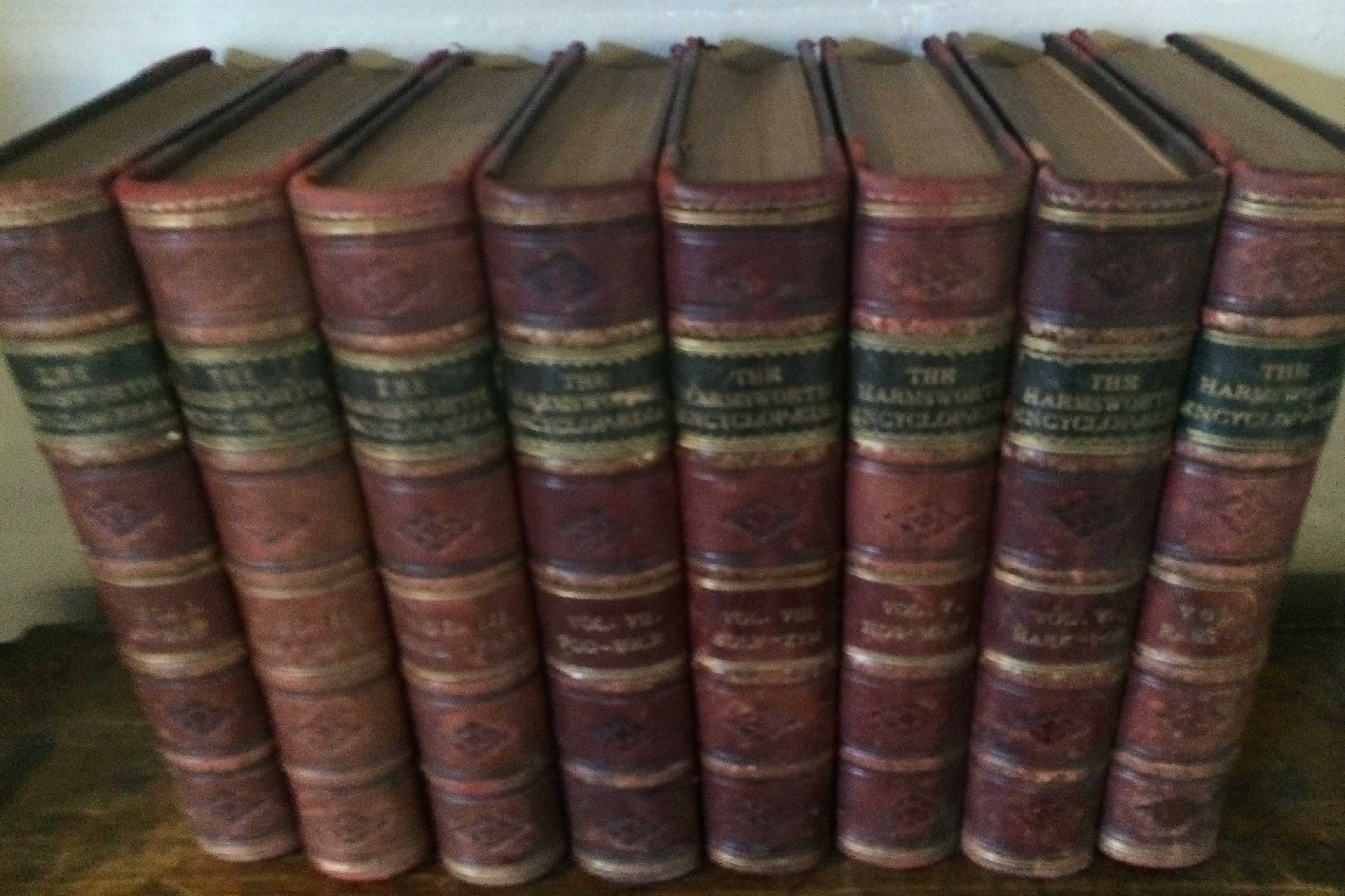 8 volume set of Harmsworths Encyclopedia  bound in dark red leather. 8 volumes. Early 20thC.