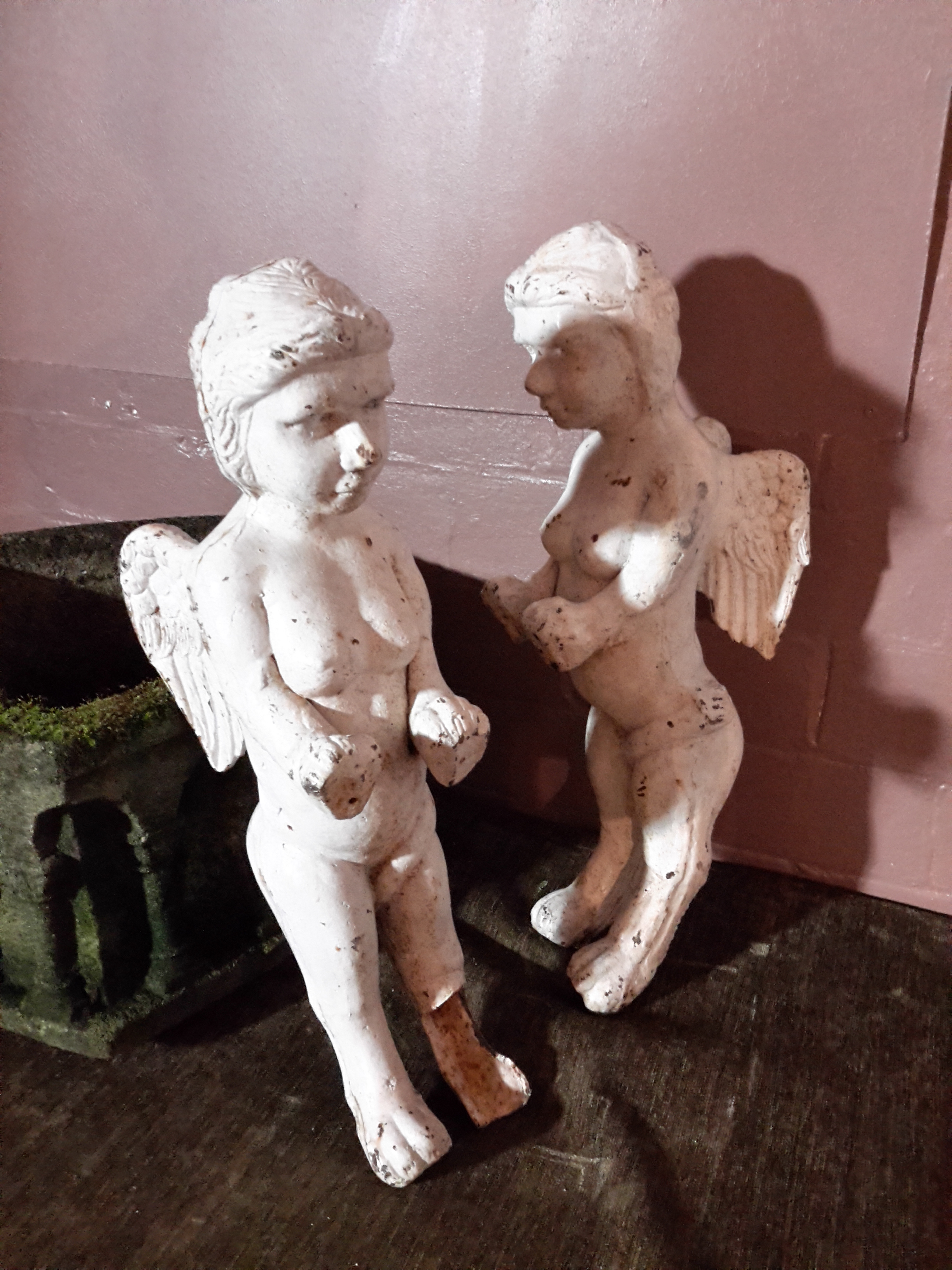 Pair of Victorian painted iron Putti. Winged with detailed form. condition: damage to the front