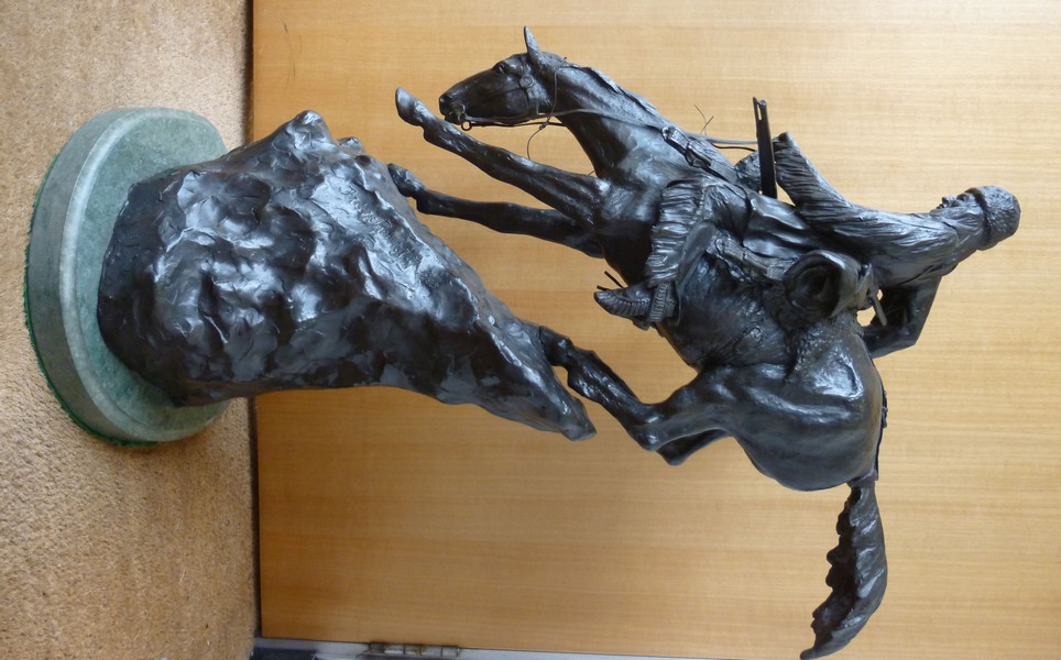 After Frederic Remington - `Mountain Man` a cast and patinated bronze, a trapper on horseback
