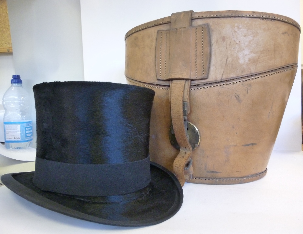 A black silk top hat bears the label of Christy`s London and Everett & Sons of Ipswich &