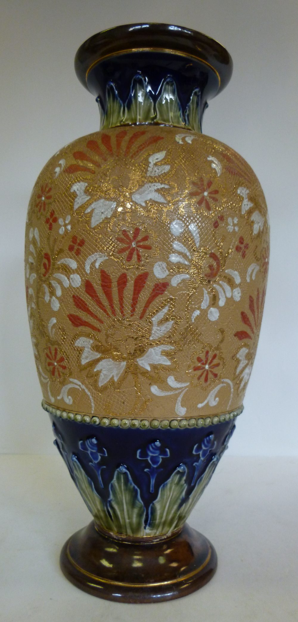 A Royal Doulton stoneware vase of baluster form, having a flared rim, decorated in Slaters Patent