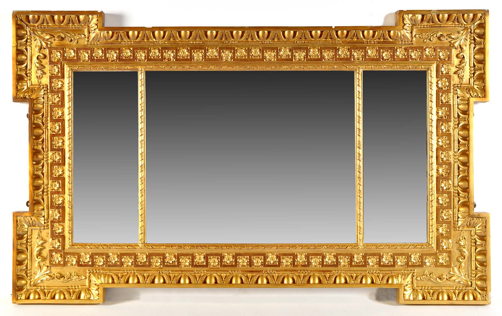 A George II style gilt overmantel mirror, in the manner of William Kent, with triple plates enclosed