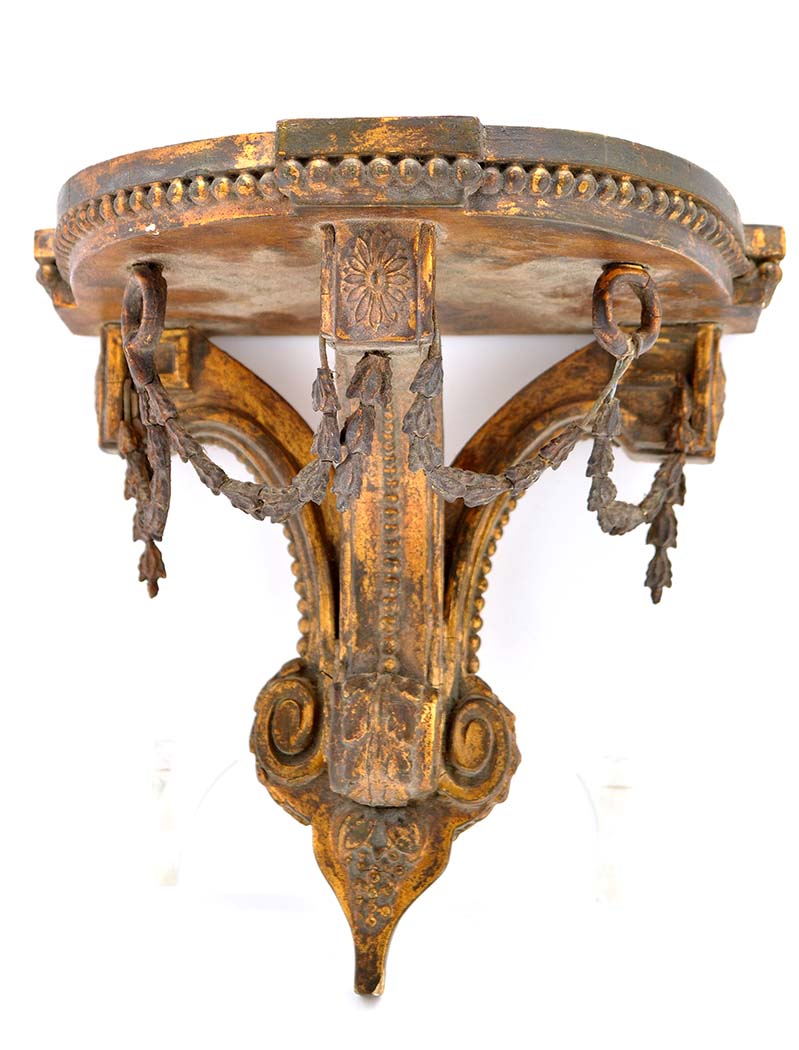 An early 20th Century giltwood wall bracket, with beaded frieze above swag designs, beadwork running