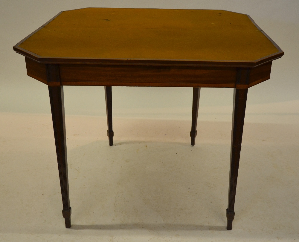 A George III satinwood and mahogany card table, the rectangular fold over top with canted corners,