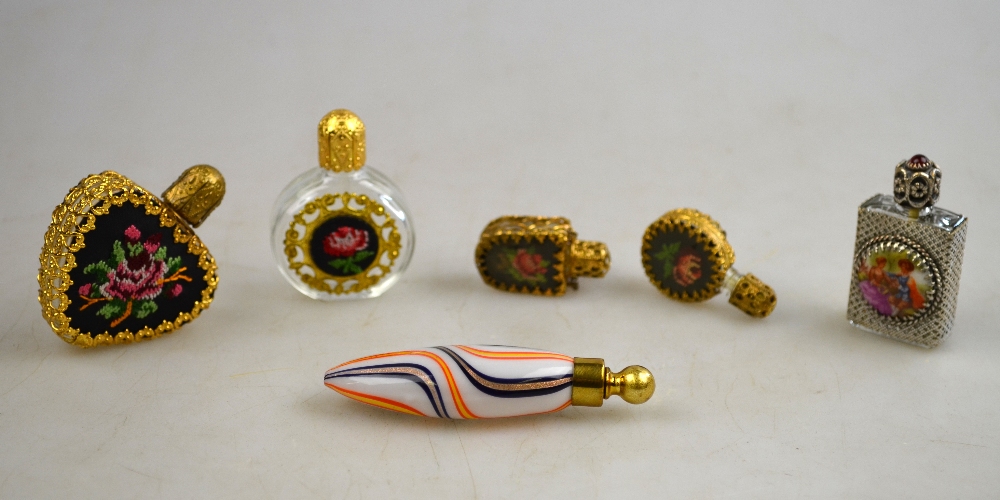 Six various small scent bottles - four with gilt metal mounts and petit-point embroidery (6)