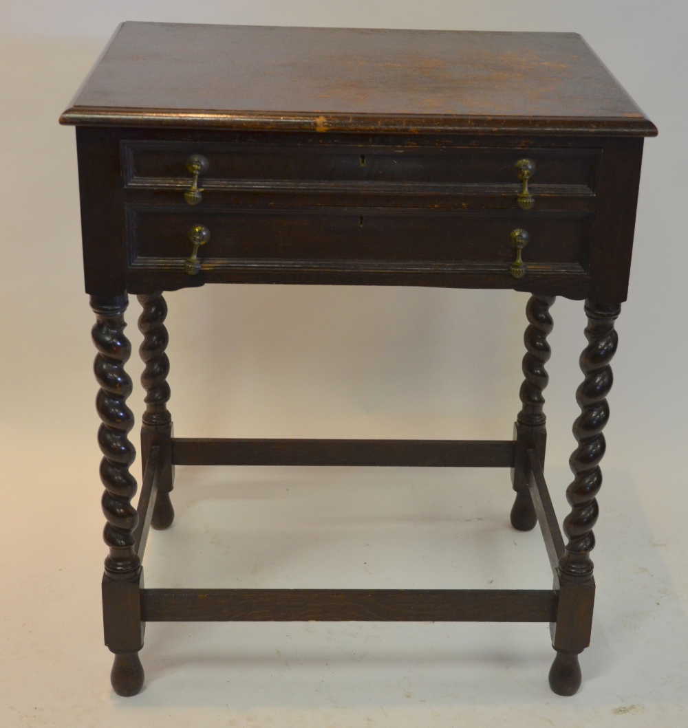 A Mappin & Webb oak canteen table with two fitted drawers, on twist supports, containing a