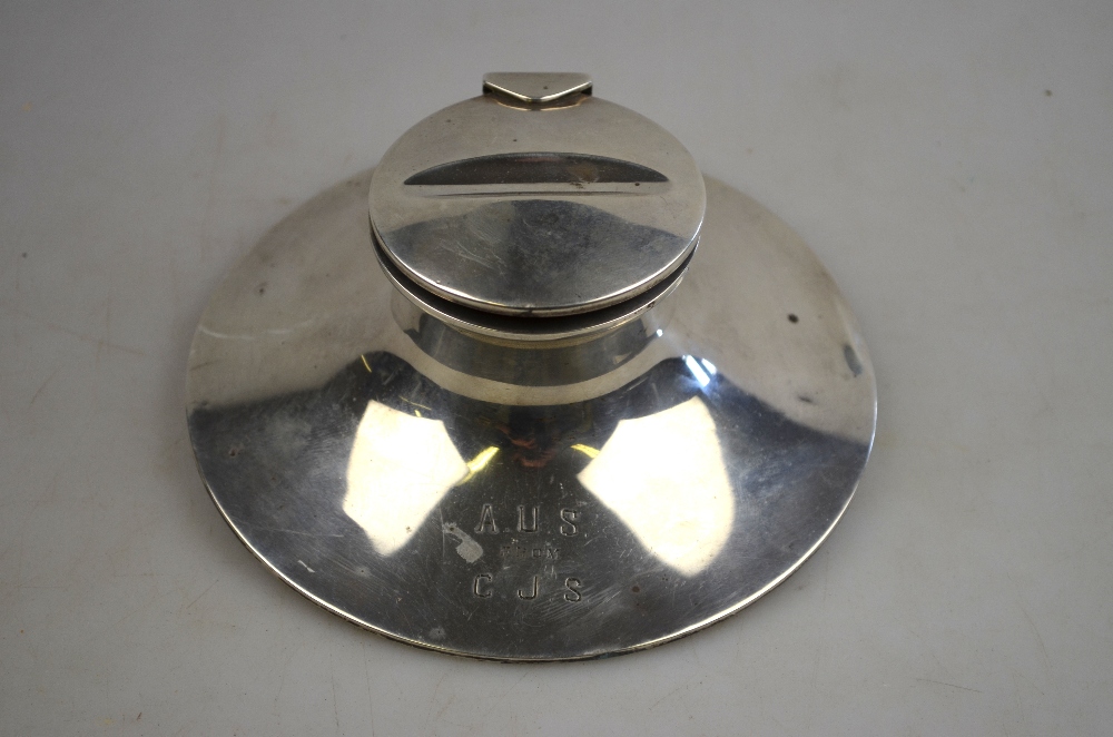 An Edwardian loaded silver capstan inkwell, the hinged lid with pen-rest, A & J Zimmerman Ltd.,