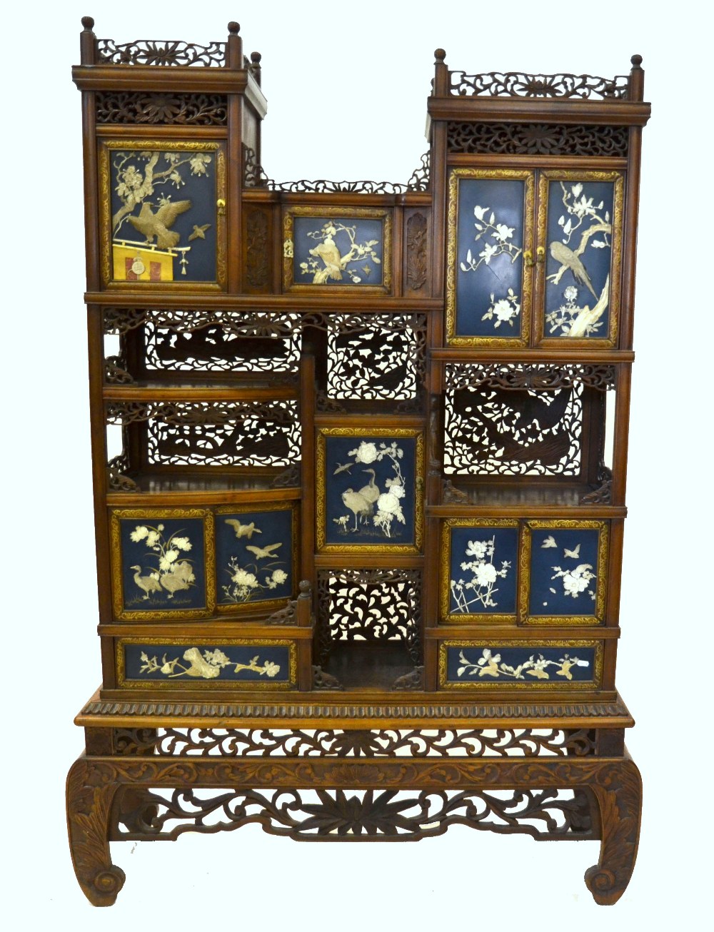 A Japanese open display cabinet comprising five cupboards above two small drawers, the doors both