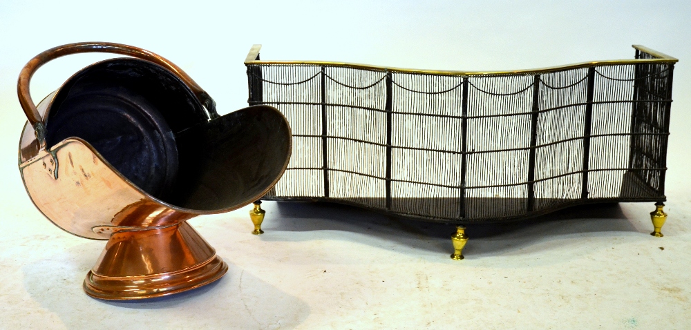 A 19th century brass and wire bowfront fireguard raised on spun brass feet, 33 cm high x 67 cm