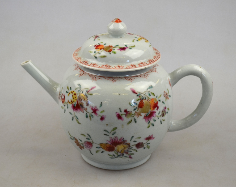 A Chinese famille rose spherical teapot painted with floral, foliage and pomegranate sprays, 18th