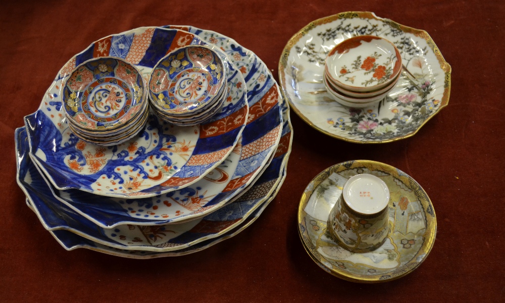 Seven Japanese Imari small saucers decorated with panels of flowers and foliage around a central