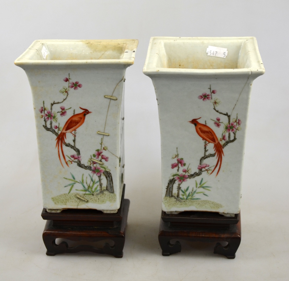 A pair of Chinese famille rose square vases with flared necks decorated with birds, flowers and