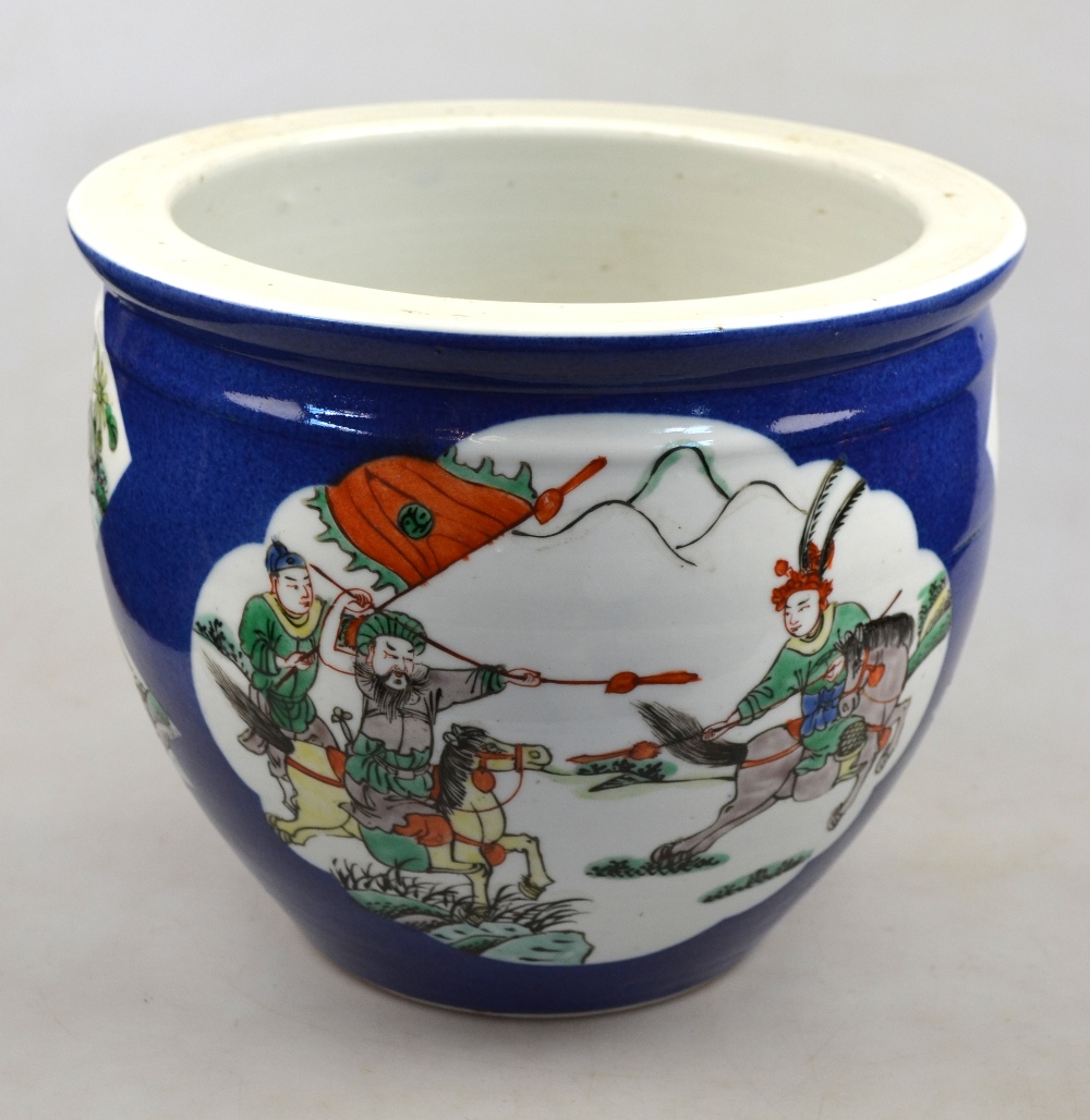 A Chinese famille vert jardiniere, the shaped cartouches decorated with figures in a landscape,