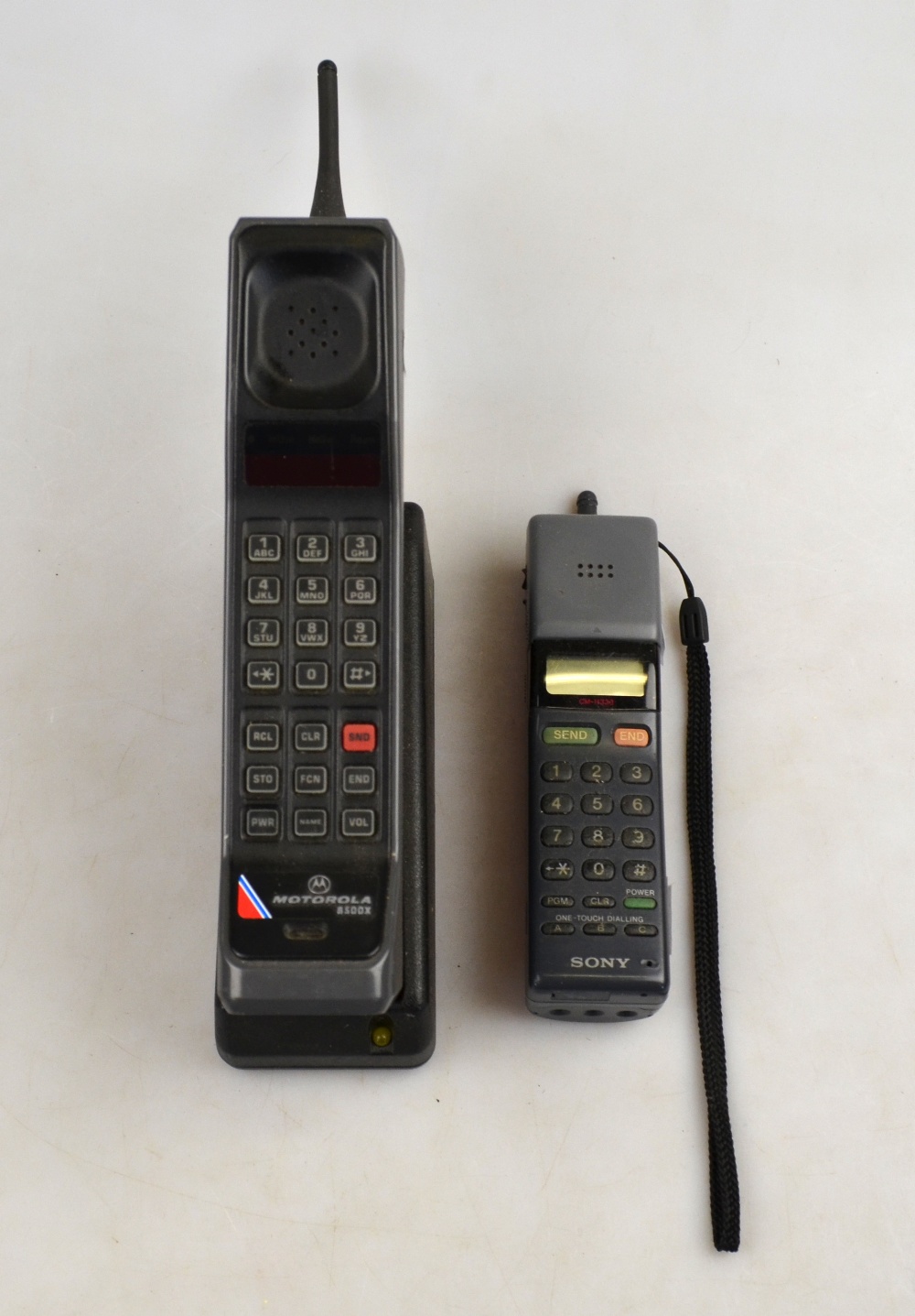 A 1980's vintage 'Motorola 8500X 'brick' mobile telephone with charger, to/w a Sony CMH 333 mobile