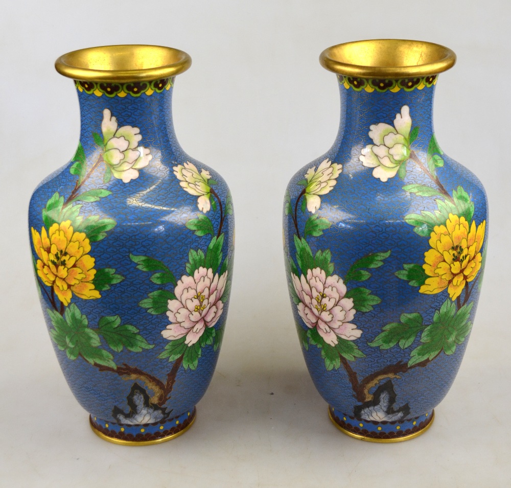 A pair of Japanese cloisonne baluster vases, blue ground, decorated with large flowers and