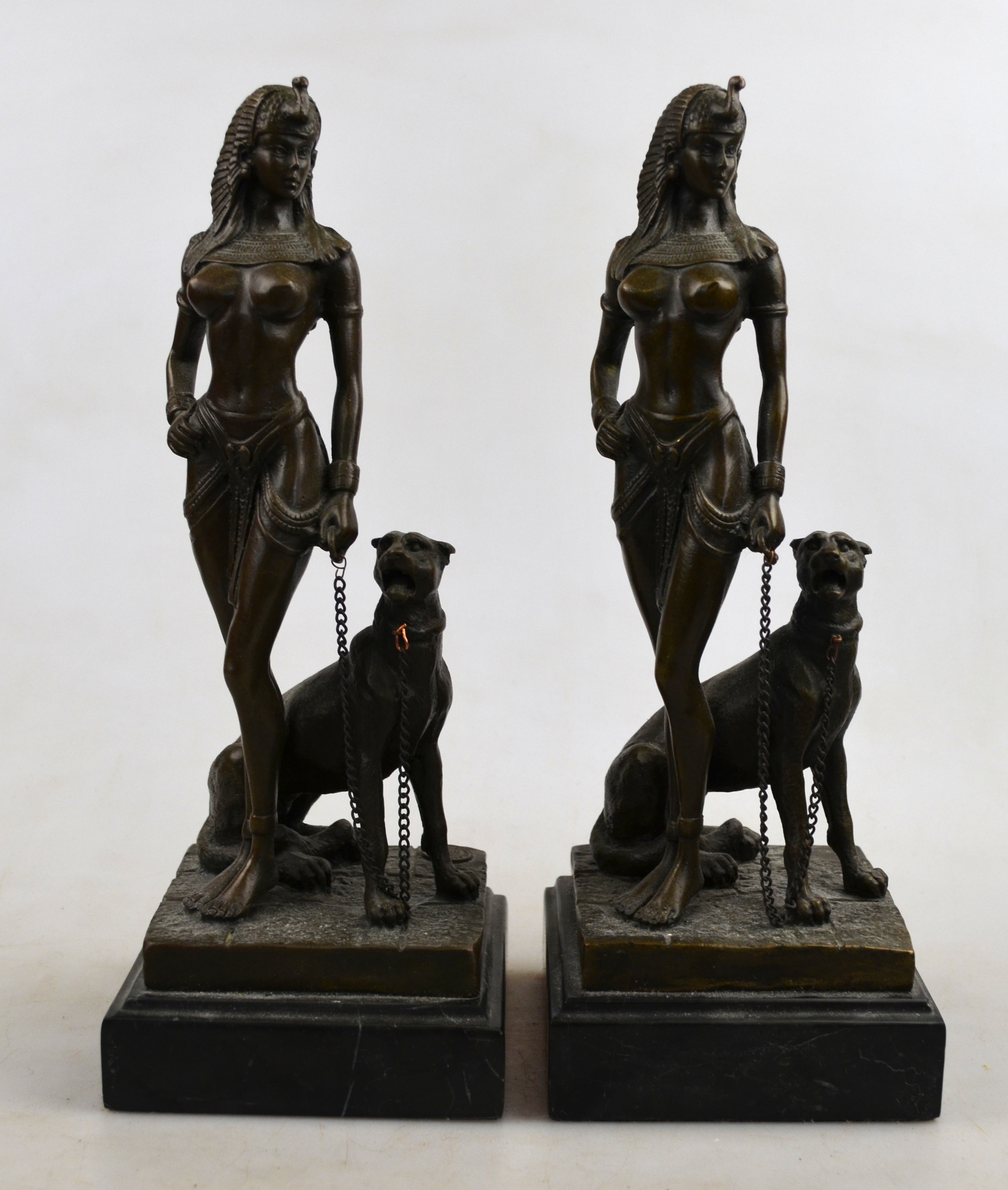 Two brown-patinated bronze figures, Egyptian female nudes with cheetahs, signed Cesaro, 26 cm high