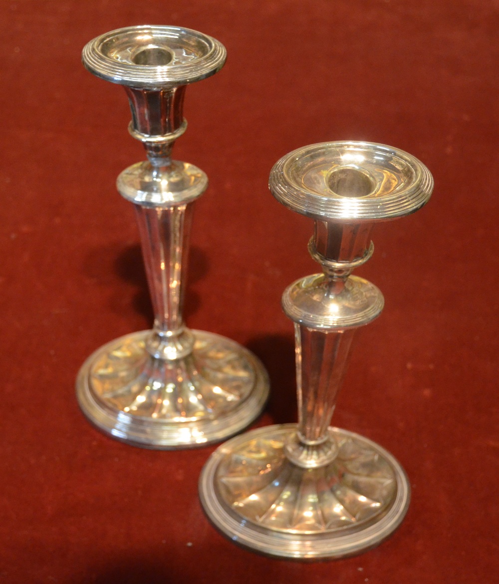 A pair of early Old Sheffield Plate 19th century oval baluster candlesticks in the Adam style, the