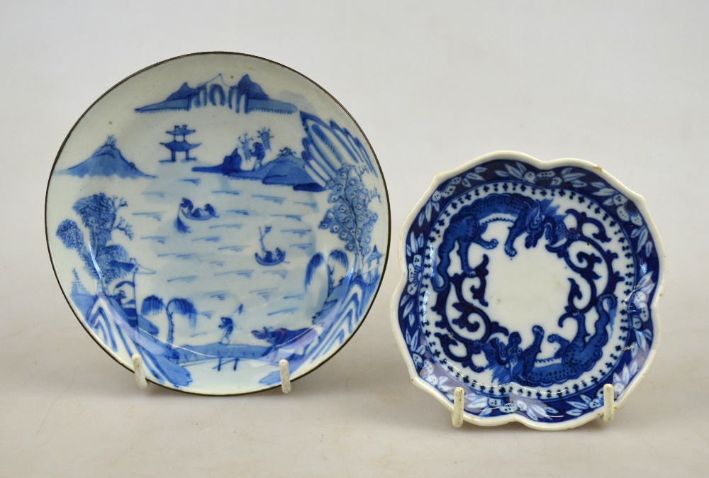 A Chinese blue and white porcelain saucer decorated with a watery landscape 12.5 cm, 18th century,