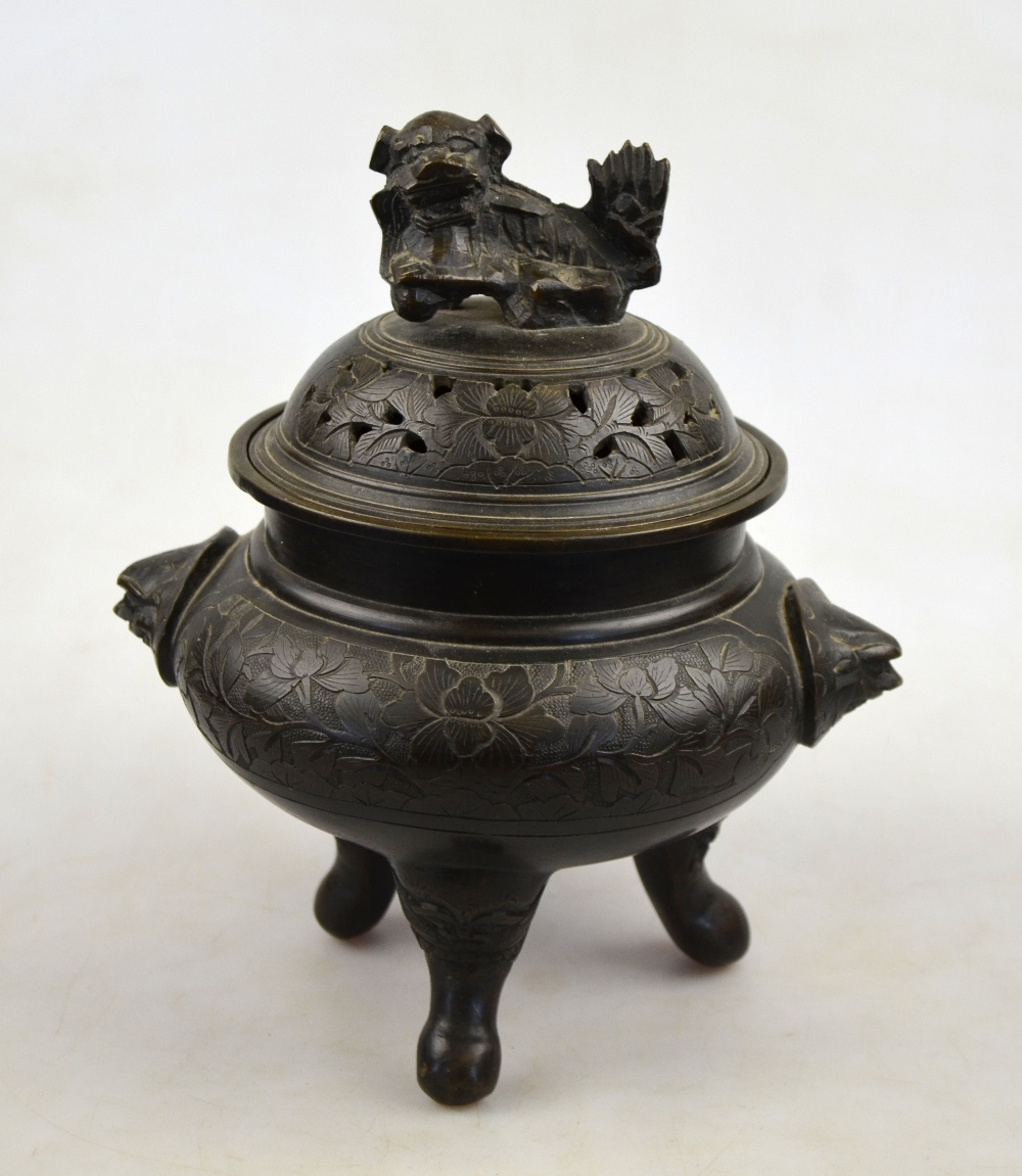 A Chinese bronze incense burner with reticulated cover and Dog of Fo finial, four character seal