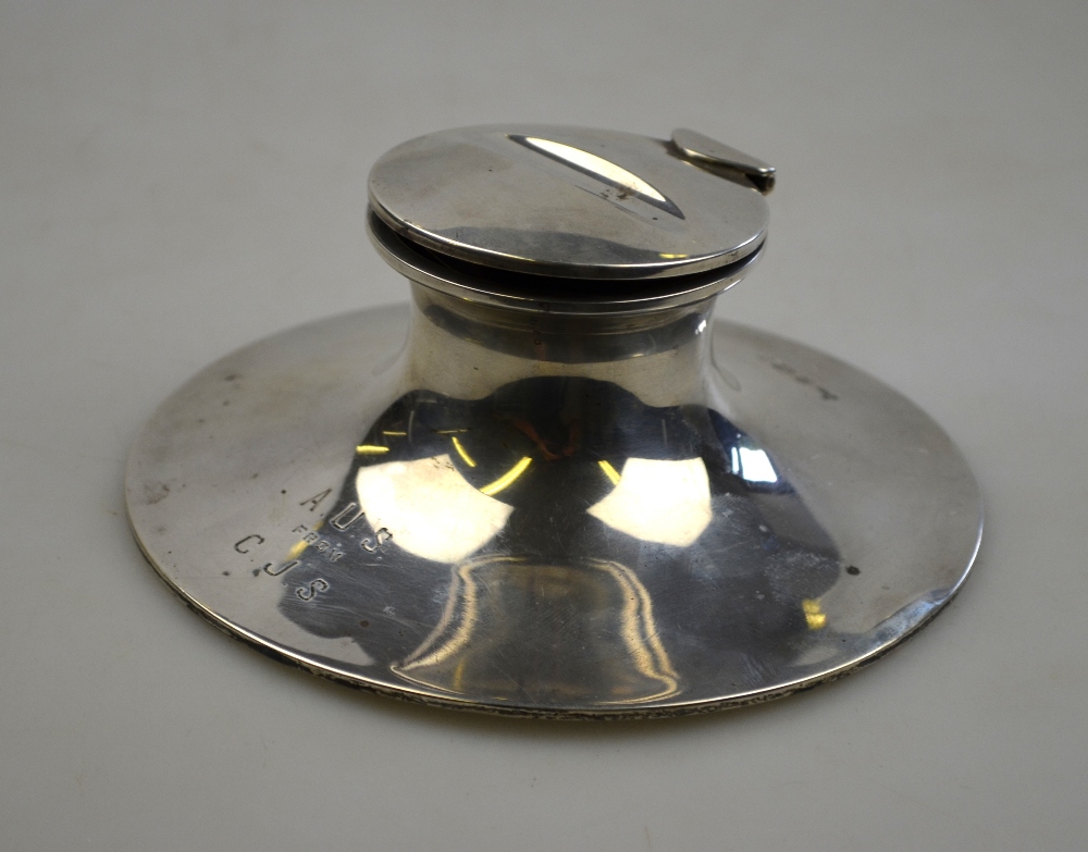 An Edwardian loaded silver capstan inkwell, the hinged lid with pen-rest, A & J Zimmerman Ltd.,