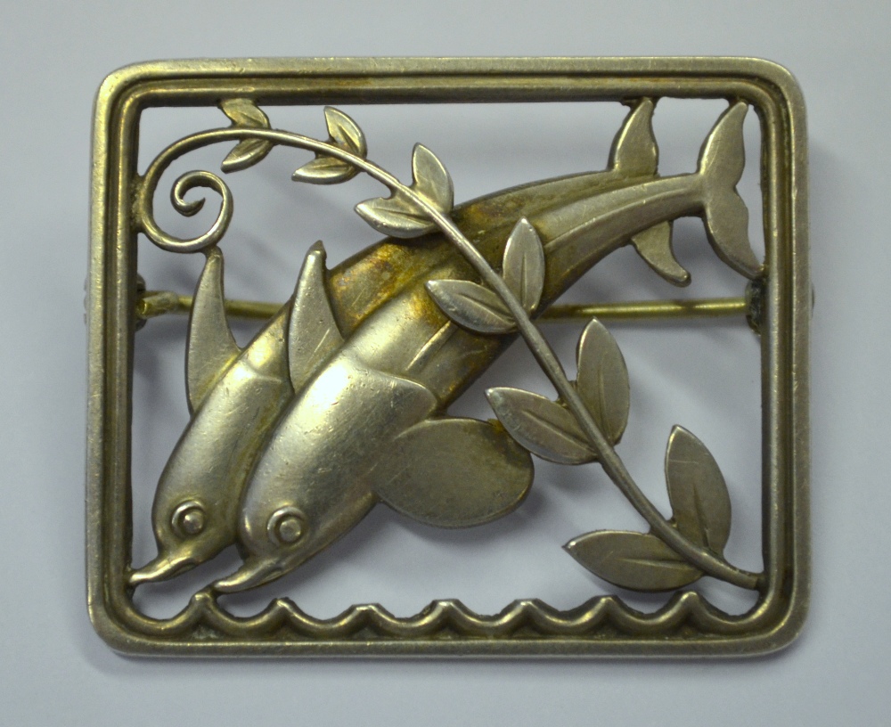 Georg Jensen, a sterling silver rectangular open framed leaping dolphin brooch no.251 designed by