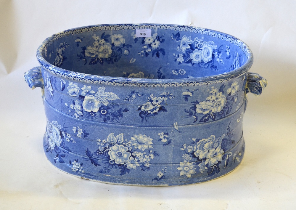 A large 19th century blue & white oval foot bath, having two shell handles, transfer decorated