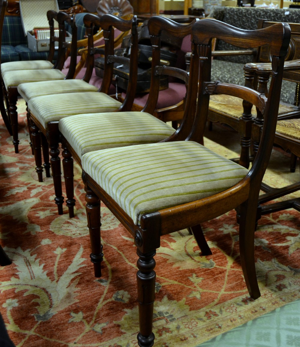 A set of six Regency rosewood dining chairs, having moulded horizontal splats over cushion seat