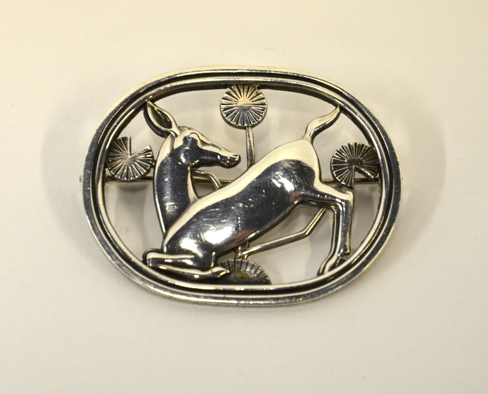 A Georg Jensen oval silver brooch no 256, featuring fawn and flowers, London import mark, 3.5 x 4.