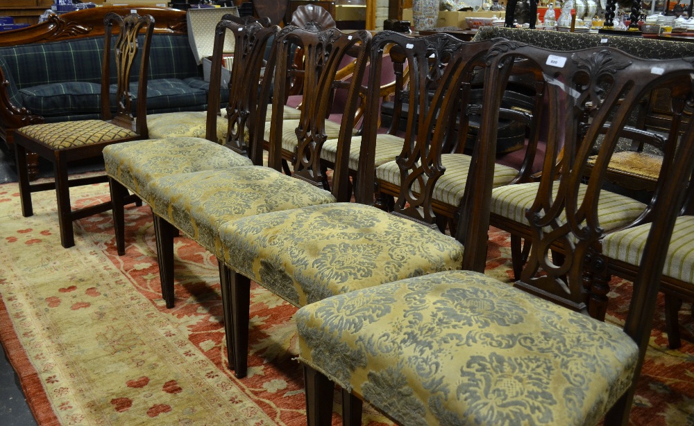 A harlequin set of six 19th century Chippendale dining chairs having moulded and pierced vertical