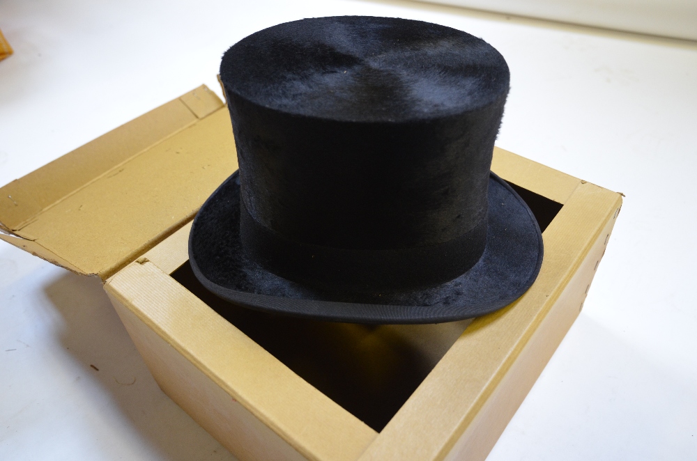 Austin Reed Ltd., Regent Street, W1, black silk top hat (19 cm front to back x 15.5 cm across) in