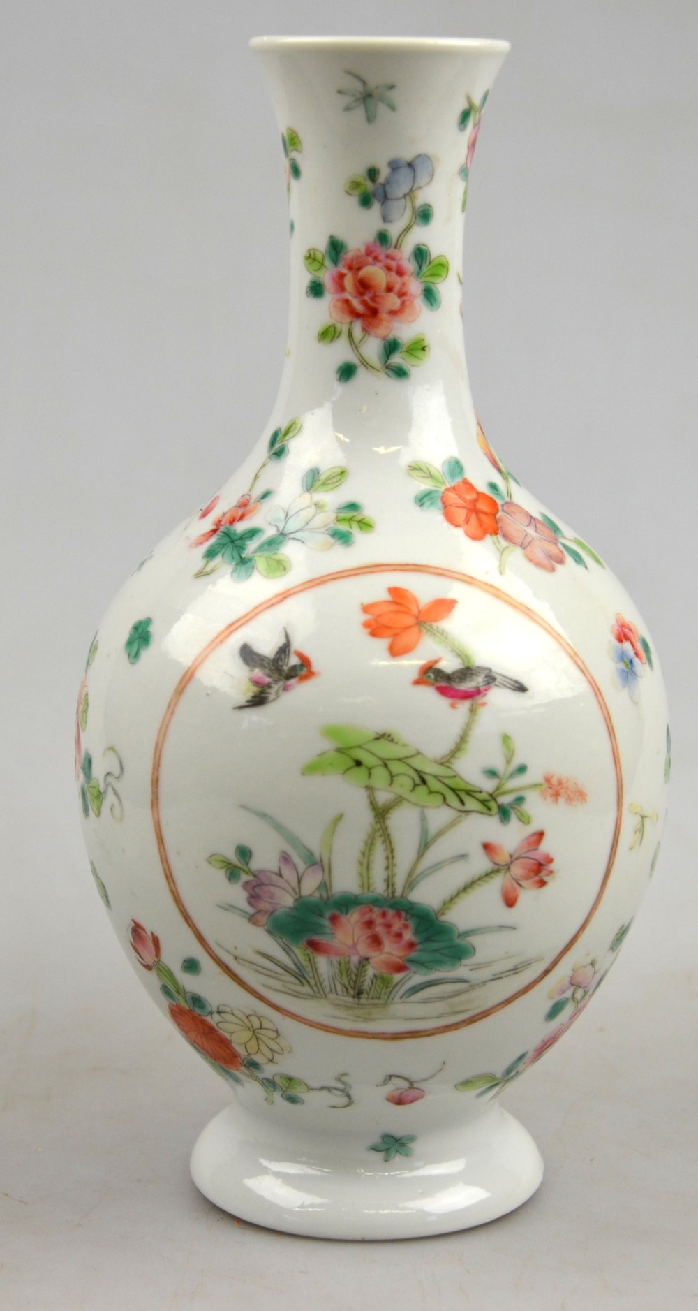 A Chinese famille rose small ovoid vase with waisted neck decorated with circular panels of birds