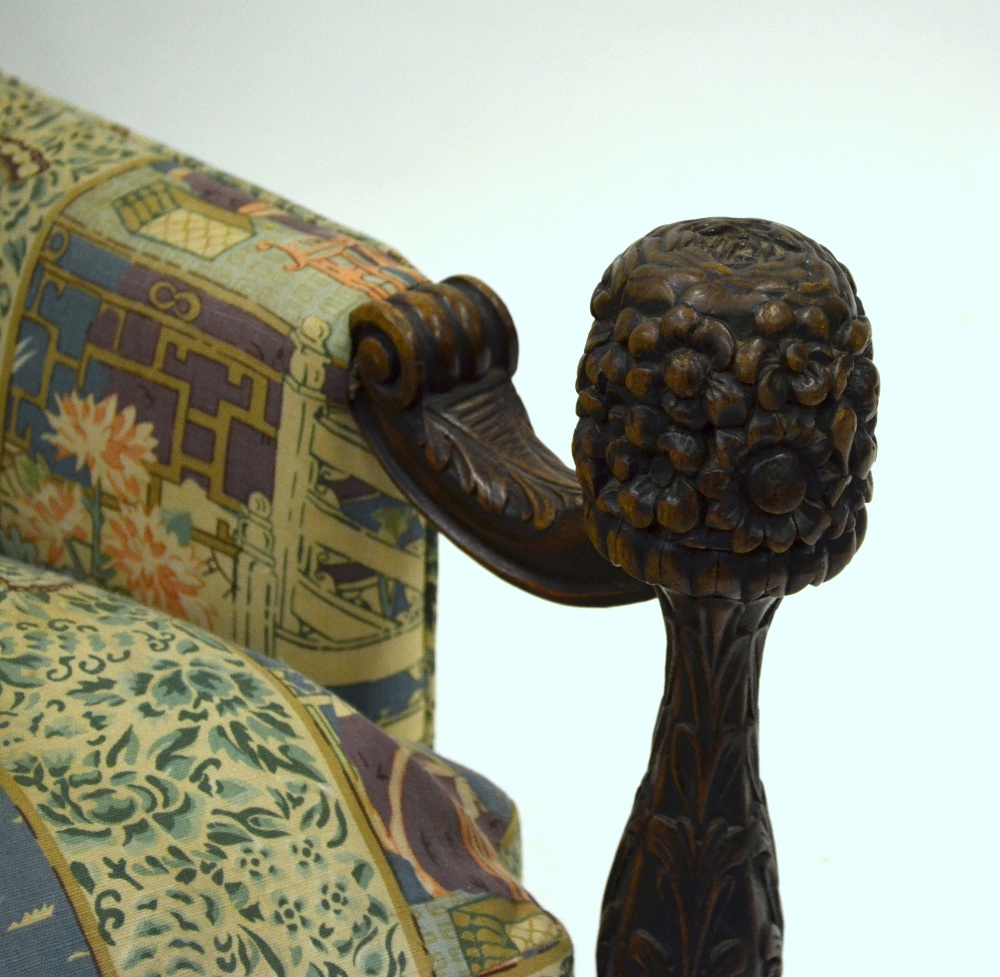 A 19th century Indian armchair, the well carved arm supports to the front legs, upholstered in - Image 2 of 2