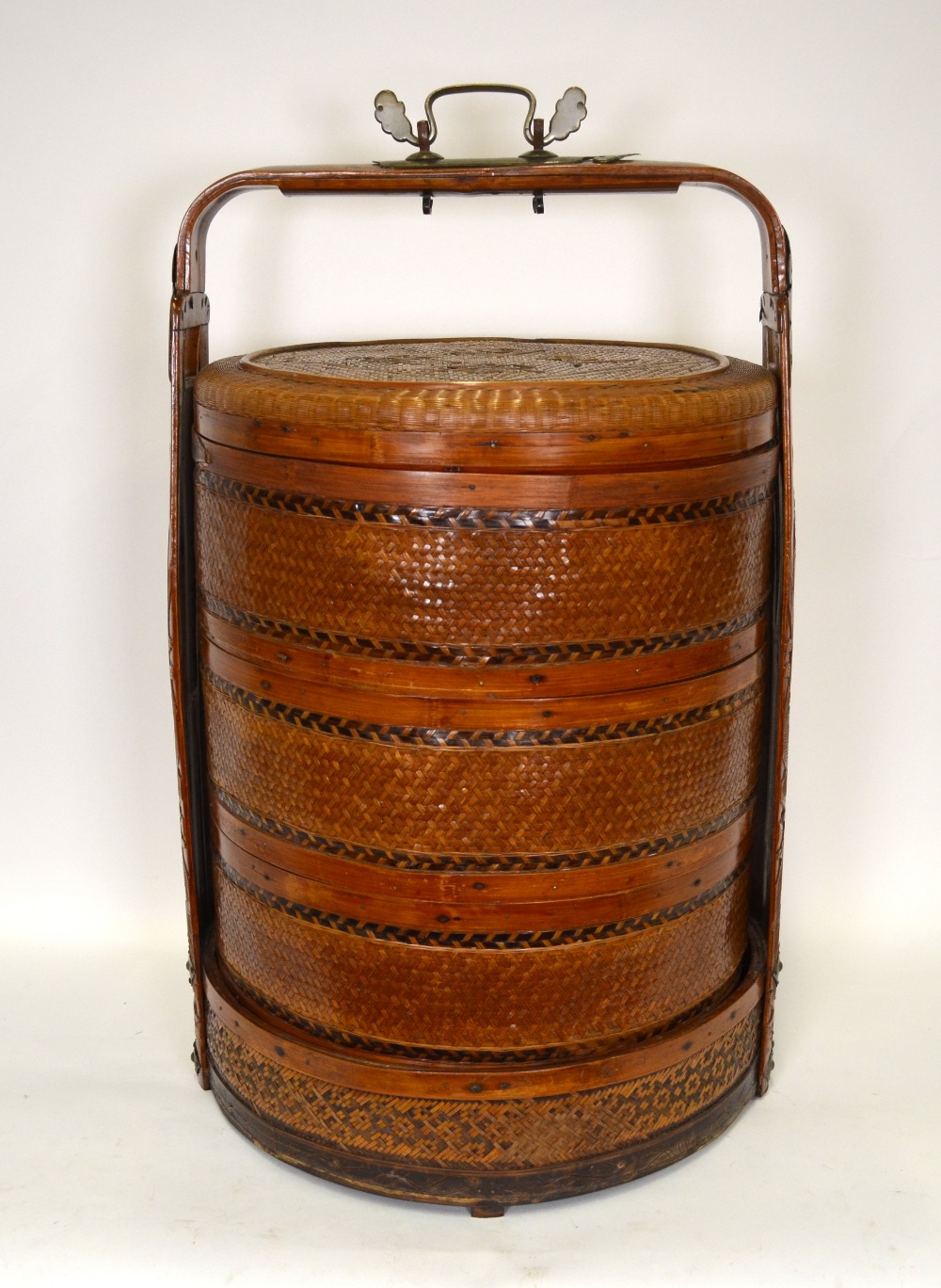 A Chinese wedding basket, split cane and bamboo, having four sections and a carved handle, 75 cm h.