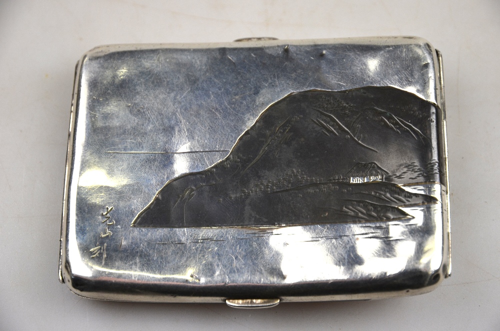 A Japanese mixed metal and silver cigarette case decorated with a watery landscape with Mount Fuji - Image 2 of 3