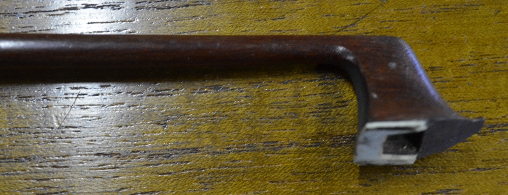 A violin bow by Nach Vuillaume (Paris)   Condition Report  Losses to end-cap of screw and head-cap - Image 5 of 5