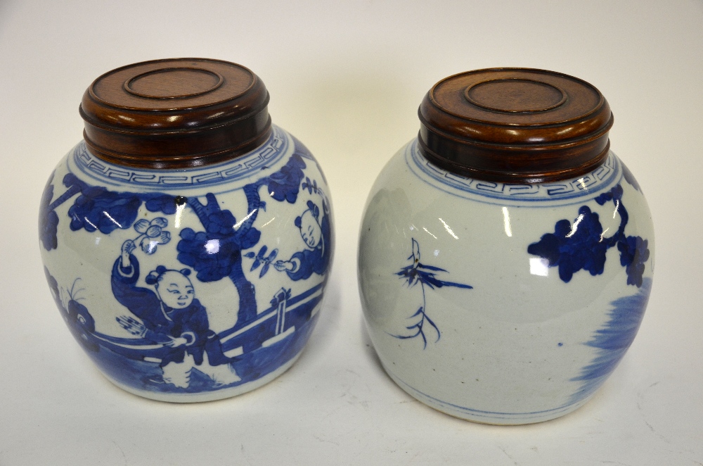 A matched pair of Chinese early 19th century blue and white ovoid vases, each decorated with boys