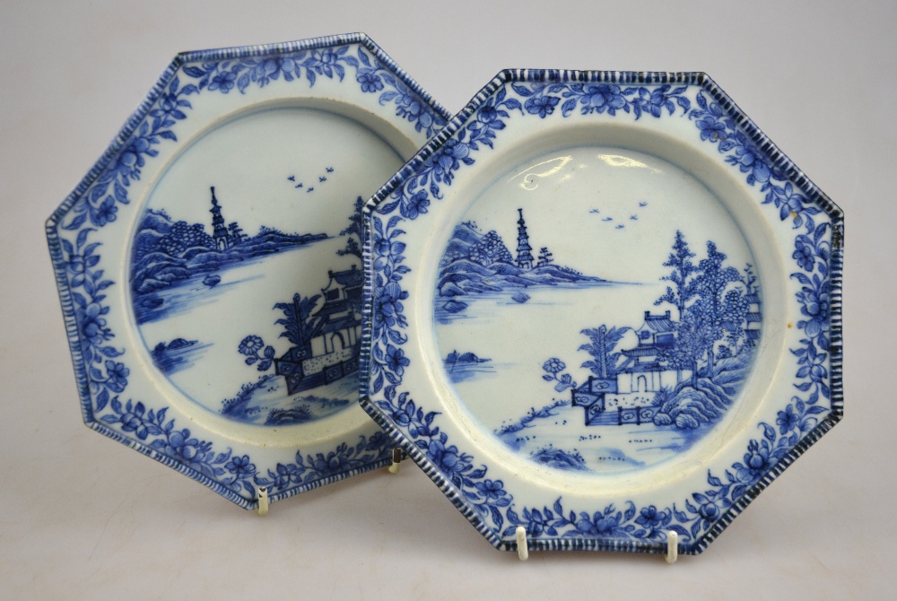 A pair of Chinese blue & white 19th century octagonal plates decorated with a watery landscape, 19