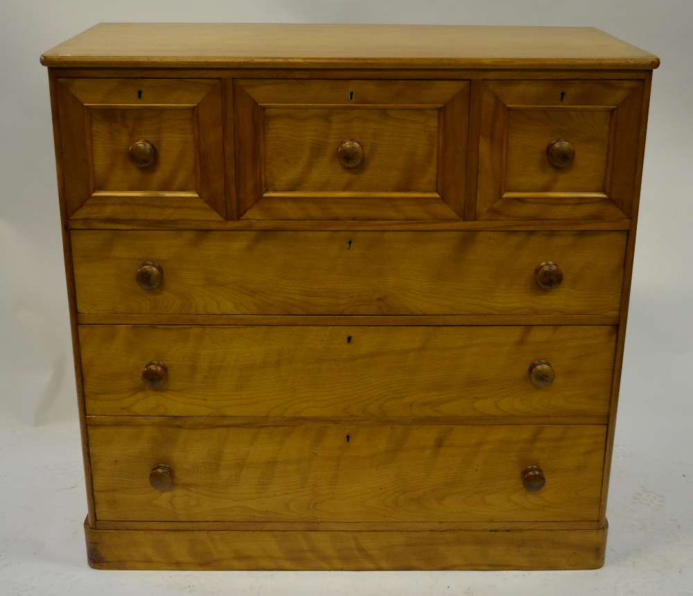 A Victorian satinwood chest of three short over three long graduated drawers each having turned