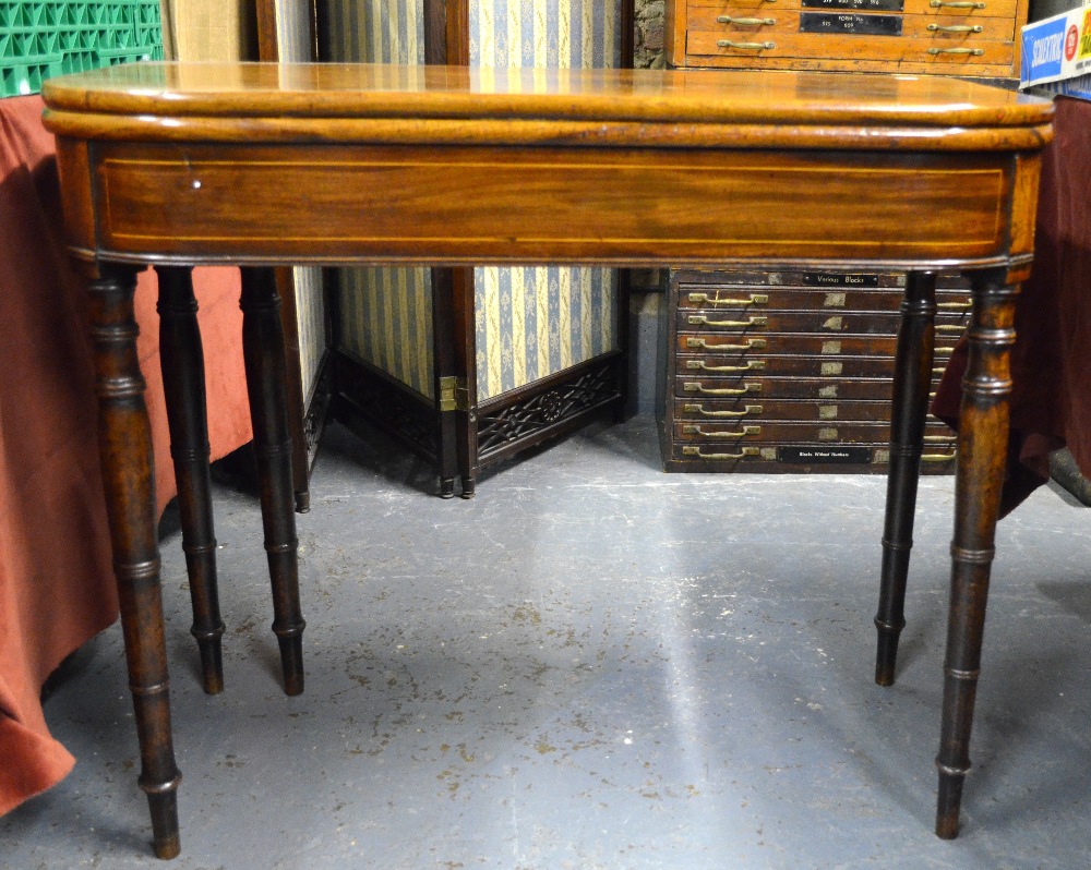 Victorian mahogany demi-lune fold-over tea table, raised on fine turned supports