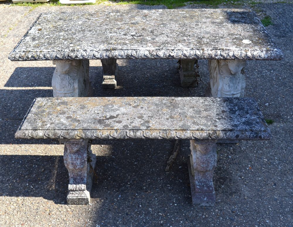 A classical styled cast stone terrace table, the rectangular top raised on a pair of pedestals to/