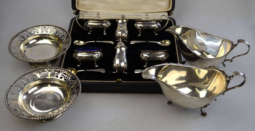 A pair of pierced silver bonbon dishes on stemmed foot rims, Atkin Bros, Birmingham 1938, to/w a
