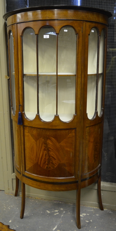 An inlaid red walnut demi-lune display cabinet, centred by a part glazed door flanked by conforming