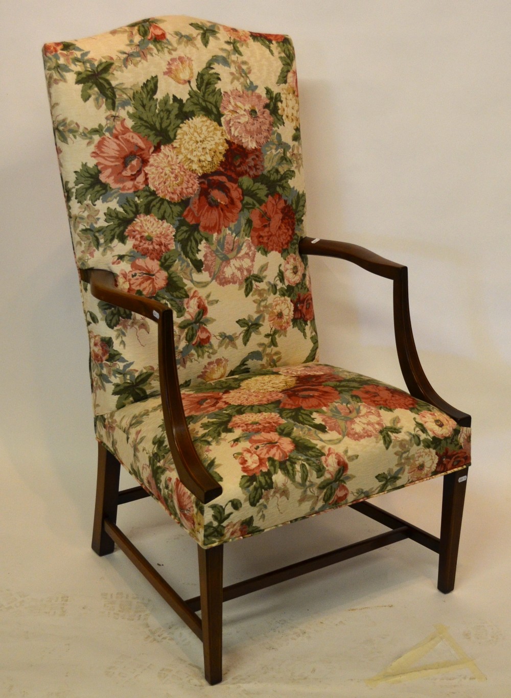 An early 19th century mahogany framed upholstered open elbow chair in Sanderson floral print