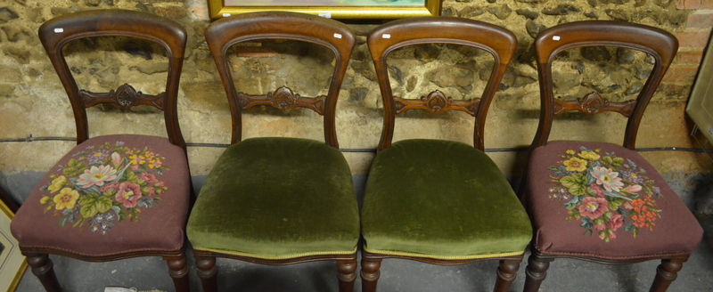 A set of six Victorian mahogany side chairs with overstuffed serpentine seats on turned front