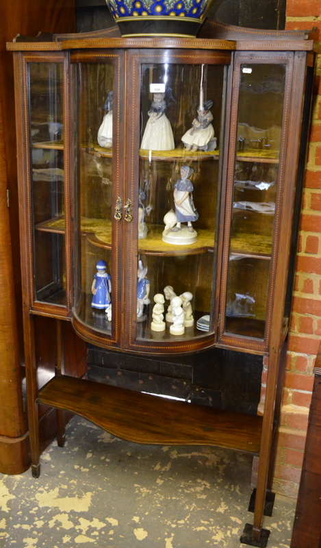 An Edwardian chequer inlaid walnut display cabinet, with a pair of bow front glazed doors flanked