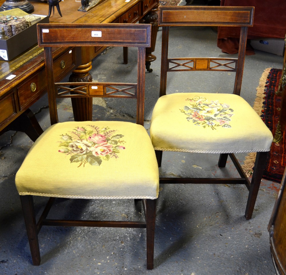 A pair of Victorian mahogany side chairs with needlework overstuffed seats (2)
