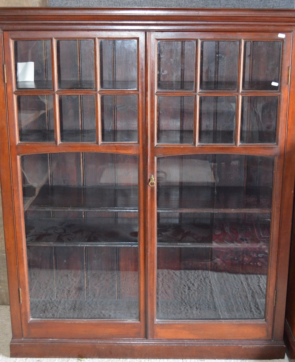 Victorian mahogany bookcase, the pair of multi-paned glazed doors enclosing adjustable shelves,