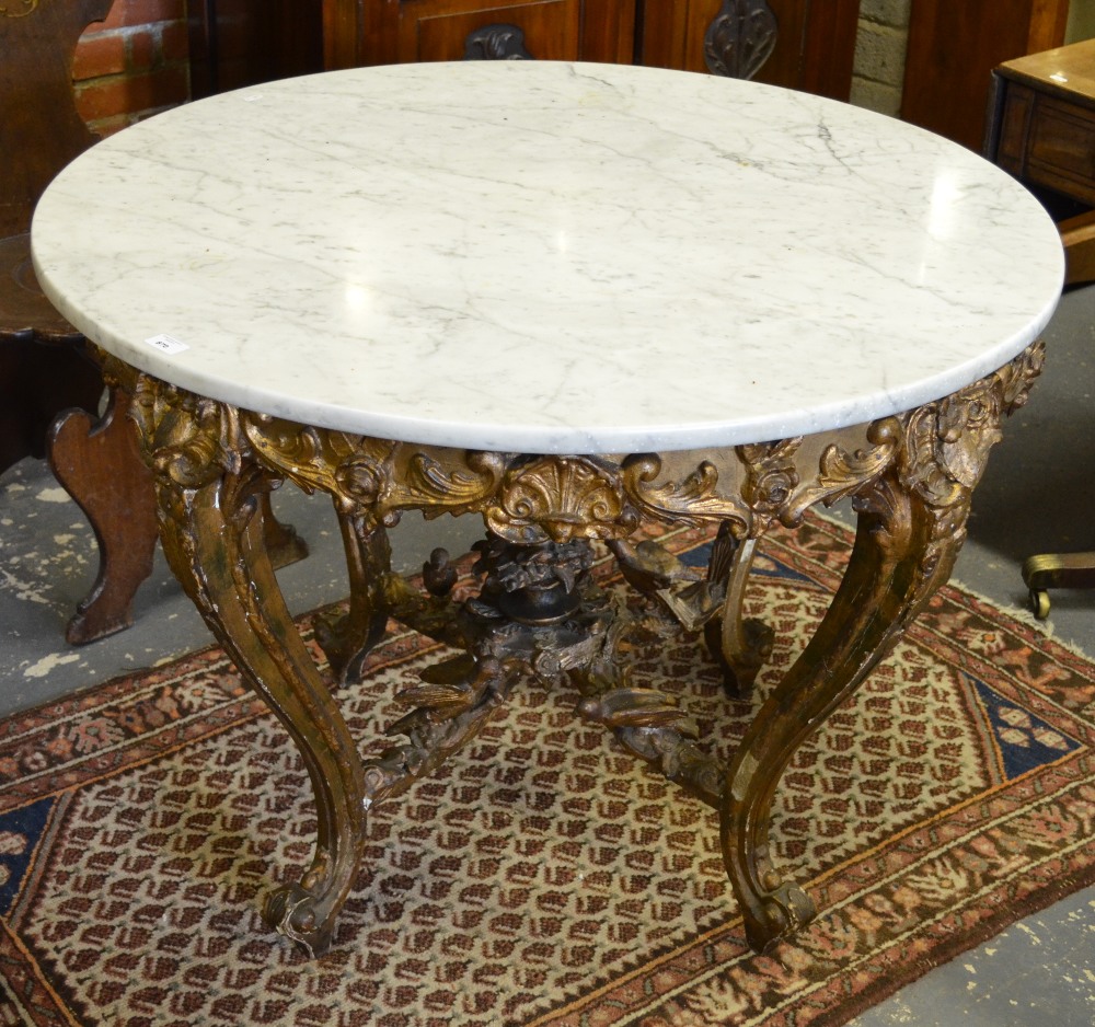 A 19th century continental carved giltwood and composite circular centre table with later veined