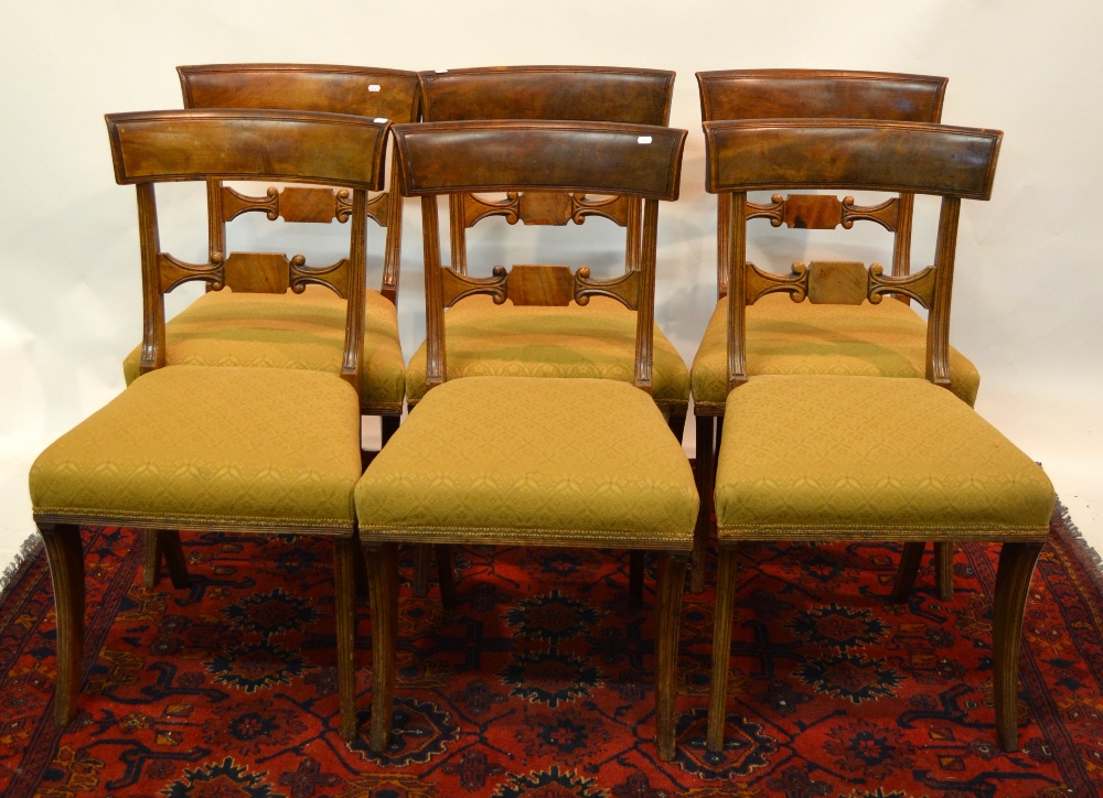 A set of seven 19th century mahogany bar back dining chairs having shaped horizontal splats over